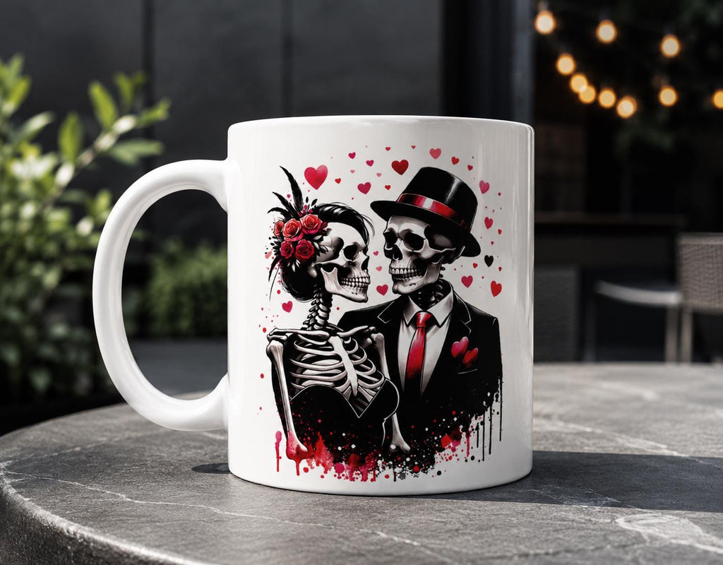 White ceramic coffee mug featuring a gothic skeleton couple design with red hearts, roses, and elegant black-and-red formal attire. Romantic dark aesthetic mug perfect for gothic decor lovers, Halloween gifts, and alternative coffee drinkware.